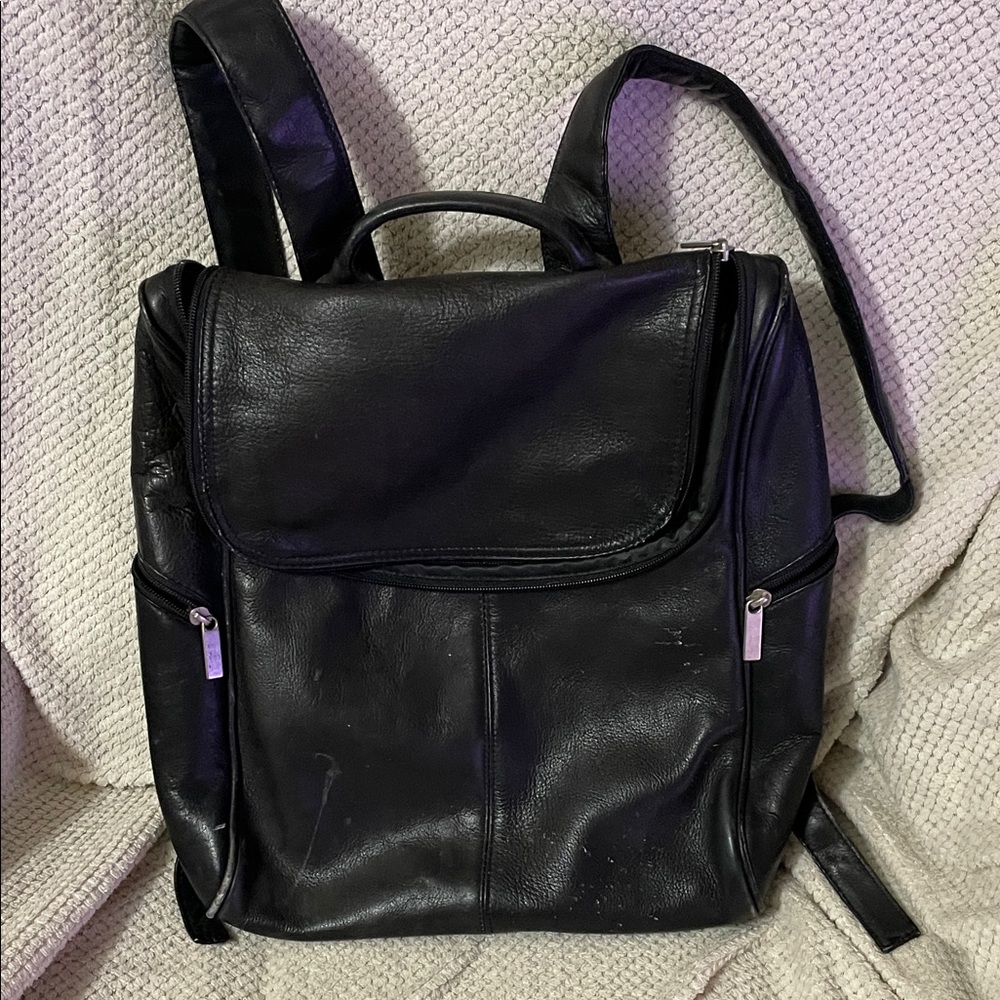 Black Leather Backpack. This backpack is very well made. Has a nice feel.
